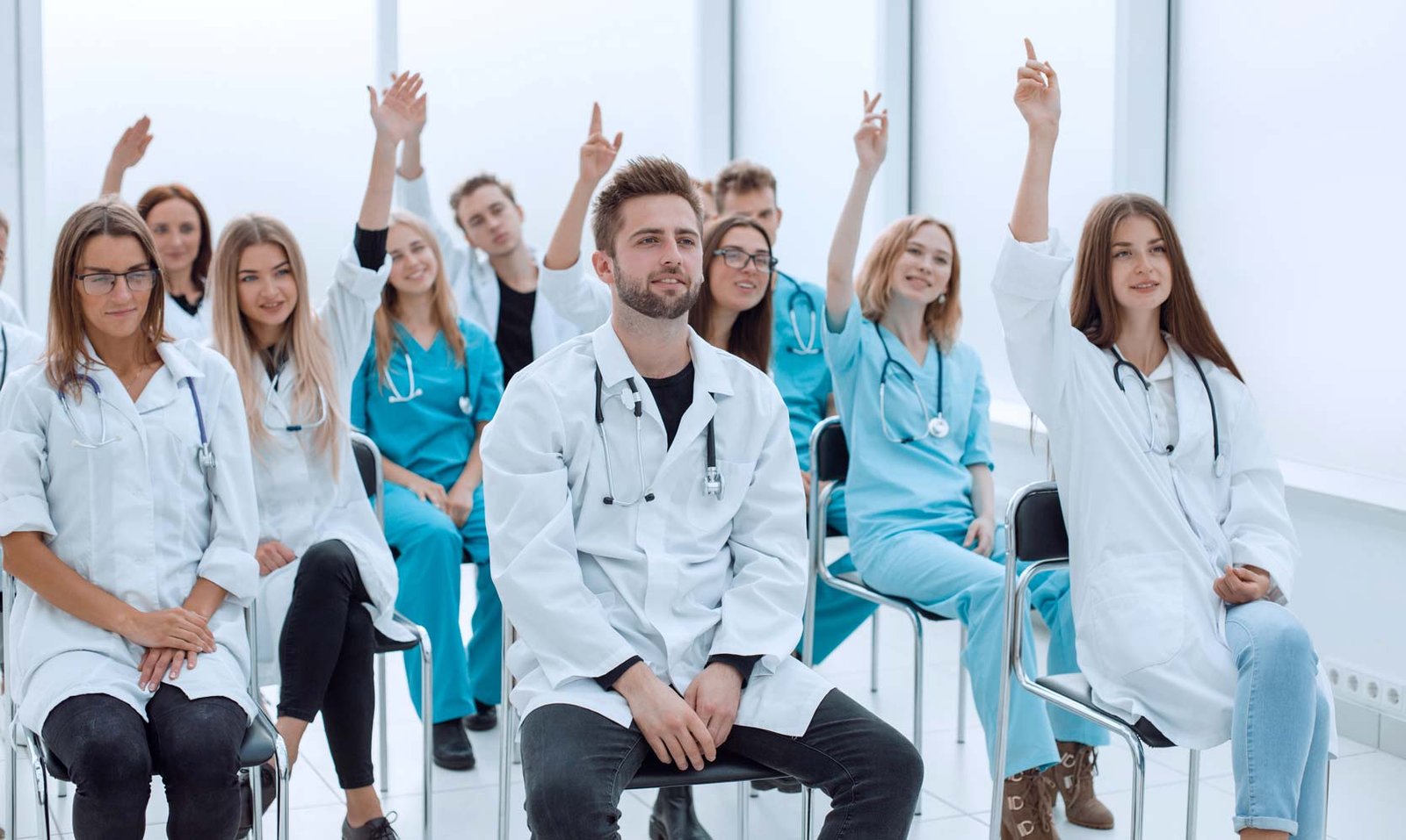 663c047736c8e5f2aed755c5 smiling doctors pointing youweb