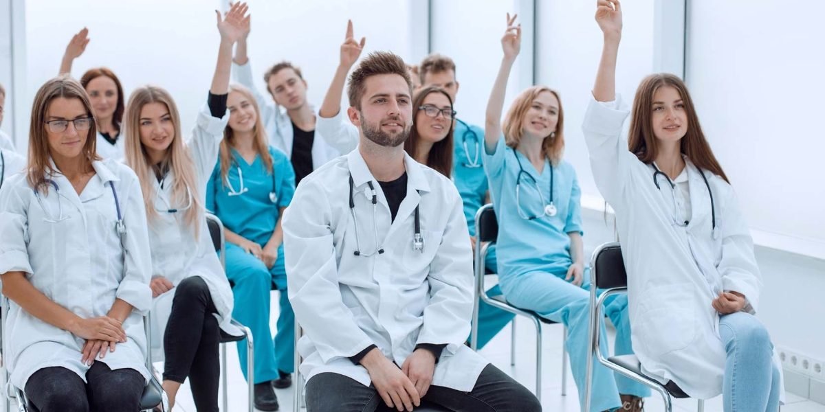 smiling doctors pointing 1200x620
